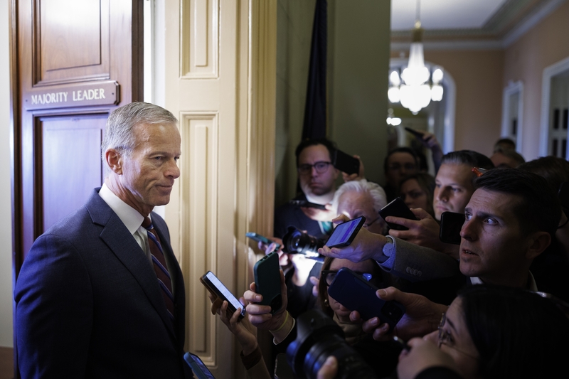 Senate Majority Leader John Thune, R-S.D., speaks to reporters while walking to his office on Nov. 10, 2025 on Capitol Hill in Washington, D.C. (Photo by Tom Brenner/Getty Images)