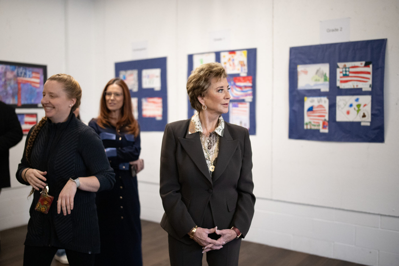 U.S. Education Secretary Linda McMahon takes in a selection of grade school students’ patriotic artworks and high schoolers’ recent output in a special installation set up at Exeter-West Greenwich Regional Junior High and High School on Monday, Jan. 12, 2026. (Photo by Alexander Castro/Rhode Island Current)