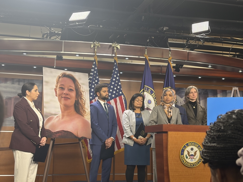 Rep. Ilhan Omar, a Minnesota Democrat, speaks at a press conference with members of the Congressional Progressive Caucus on Jan. 13, 2026. At left is a photo of Renee Good, 37, who was killed by an immigration officer in Minneapolis. (Photo by Ariana Figueroa/States Newsroom)
