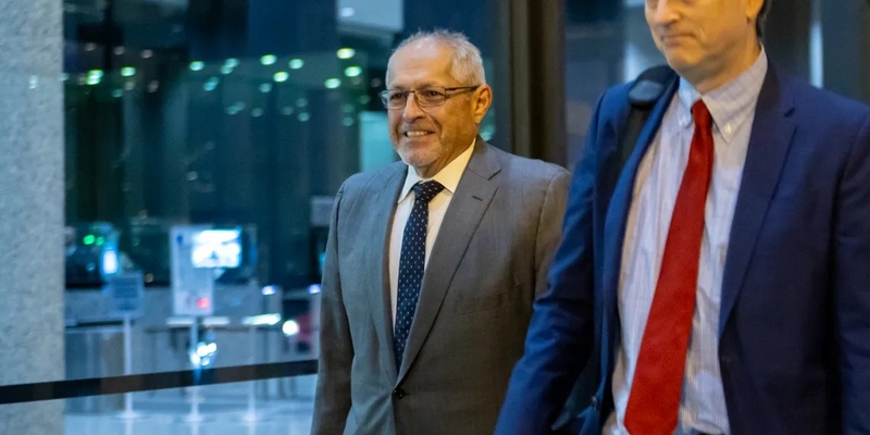 Fidel Marquez, a former Commonwealth Edison executive-turned-cooperating witness, leaves the Dirksen Federal Courthouse with his attorney on Tuesday, Nov. 12, 2024, after his fifth day of testimony in the bribery and racketeering trial of former Illinois House Speaker Michael Madigan. (Capitol News Illinois photo by Andrew Adams)