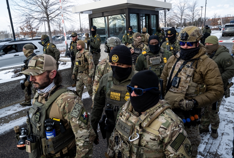 Federal agents stage at a front gate as Rep. Ilhan Omar (D-MN), Rep. Kelly Morrison (D-MN), and Rep. Angie Craig (D-MN) attempt to enter the regional ICE headquarters at the Bishop Henry Whipple Federal Building on January 10, 2026 in Minneapolis, Minnesota. The Congresspeople were briefly allowed access to the facility where the Department of Homeland Security has been headquartering operations in the state. (Photo by Stephen Maturen/Getty Images)