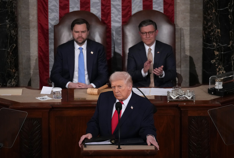U.S. President Donald Trump, with Vice President JD Vance and Speaker of the House Mike Johnson, R-La., looking on, delivers his State of the Union address during a Joint Session of Congress at the U.S. Capitol on Feb. 24, 2026, in Washington, D.C. (Photo by Andrew Harnik/Getty Images)