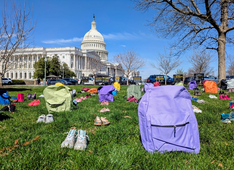 Win Without War, a peace advocacy group, displayed children's backpacks and shoes on Capitol Hill on March 18, 2026, to protest a U.S. strike on a school in southern Iran that killed over 100 children on Feb. 28. (Photo by Ashley Murray/States Newsroom)