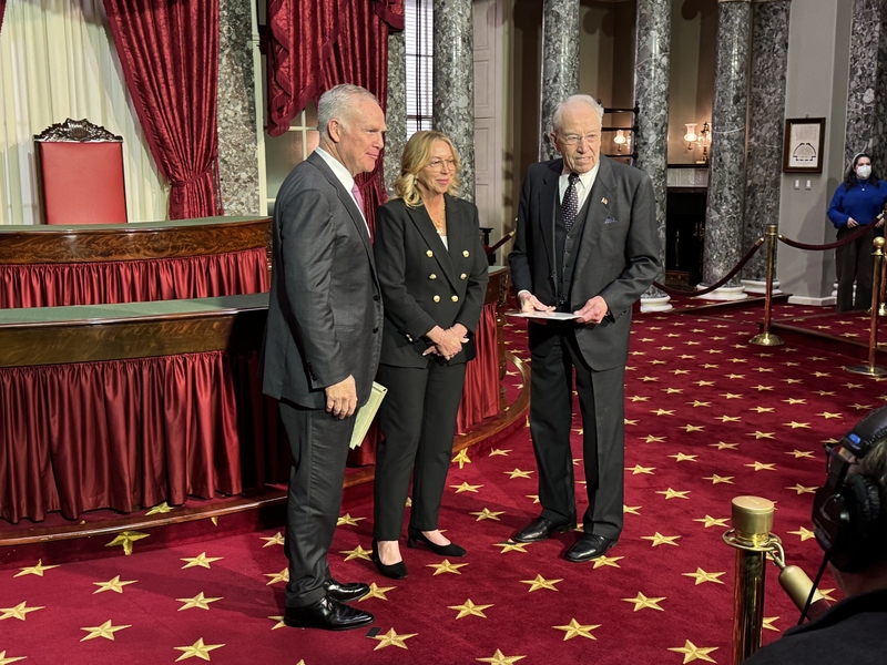 Alan Armstrong, left, Oklahoma’s newest U.S. senator, participates in a reenactment of his swearing-in at the U.S. Capitol on March 24, 2026, alongside his wife, Shelly Armstrong, and Iowa GOP Sen. Chuck Grassley, president pro tempore of the Senate. (Photo by Shauneen Miranda/States Newsroom)