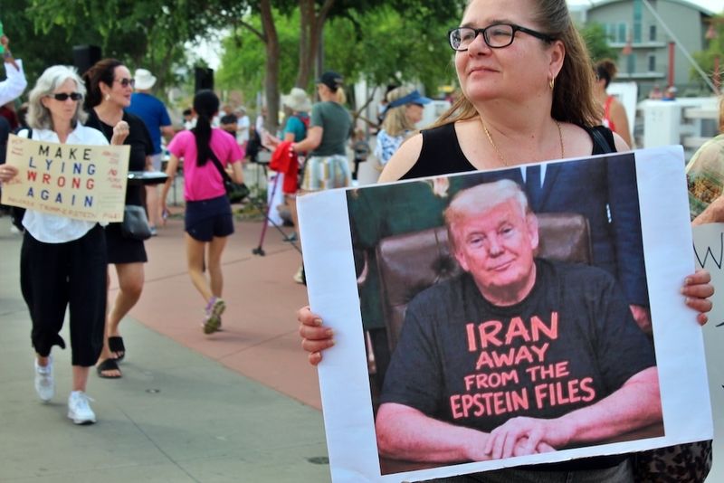 Protesters gather at a No Kings rally at a busy intersection in Scottsdale, Arizona, on Saturday, March 28, 2026, to denounce President Donald Trump and his political movement. (Photo by Rebecca Gloria Gomez/Arizona Mirror)