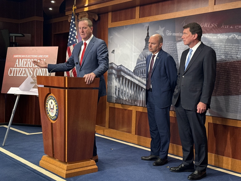 Missouri Republican Sen. Eric Schmitt speaks during a U.S. Capitol press conference on a nationwide voter identification bill on March 18, 2026. Also pictured, from left, are Utah Republican Sen. Mike Lee and Tennessee Republican Sen. Bill Hagerty. (Photo by Jennifer Shutt/States Newsroom)