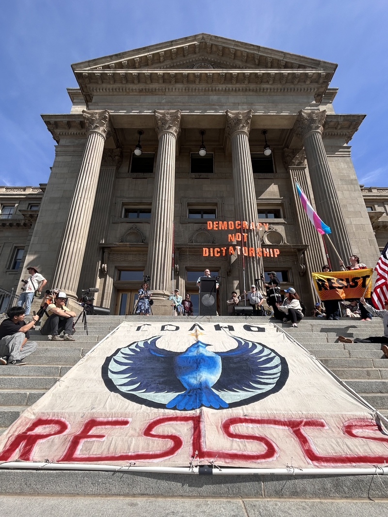 An "Idaho Resists" banner drapes the stairs of the Statehouse in Boise during the city's third No Kings protest on Saturday, March 28, 2026. (Photo by Christina Lords/Idaho Capital Sun)