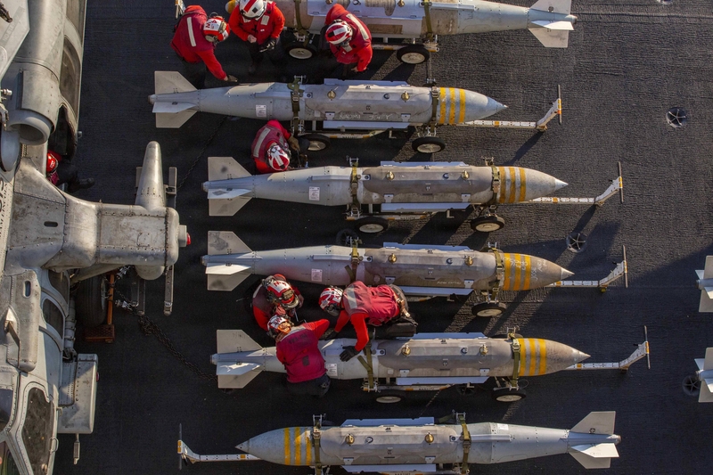 Sailors prepare to stage ordnance on the flight deck of the USS Abraham Lincoln in support of Operation Epic Fury in the U.S. Central Command area of responsibility, Feb. 28, 2026. (Photo by U.S. Navy)
