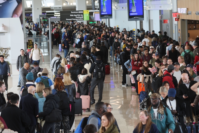 People wait in long security lines at LaGuardia Airport on March 25, 2026 in the Queens borough of New York City. Travel disruptions continue as hundreds of TSA agents have quit or are working without pay during a partial government shutdown. (Photo by Spencer Platt/Getty Images)