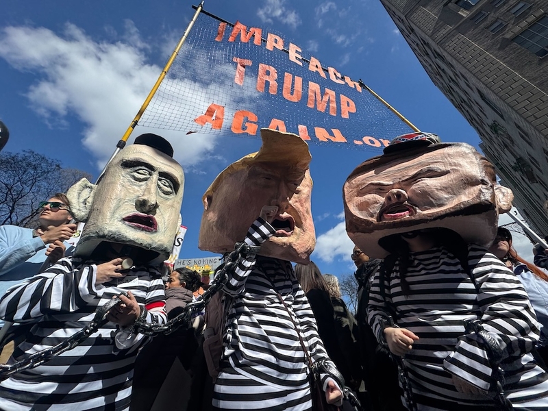 Protesters in New York City don costumes depicting White House Deputy Chief of Staff Stephen Miller, President Donald Trump and Vice President JD Vance during a No Kings demonstration on Saturday, March 28, 2026. (Photo by Shalina Chatlani/Stateline)