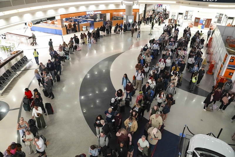 Travelers wait in long lines early in the morning at Atlanta Hartsfield-Jackson International Airport on March 26, 2026 in Atlanta, Georgia. (Photo by Megan Varner/Getty Images)
