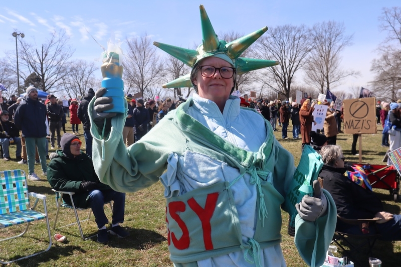 In Milwaukee, Wisconsin, a protester in a Statue of Liberty costume at a No Kings rally on Saturday, March 28, 2026. (Photo by Isiah Holmes/Wisconsin Examiner)
