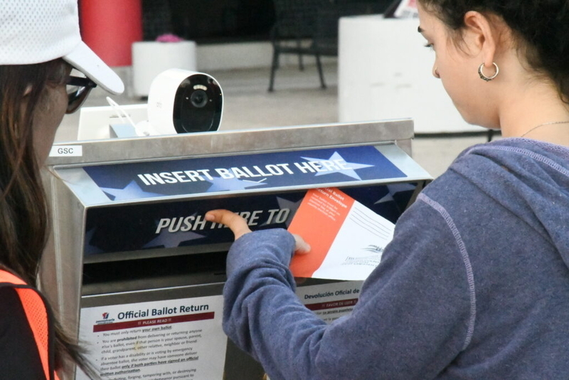 A voter deposits a mail-in ballot at the drop box outside the Chester County Government Center on Tuesday, Nov. 5, 2024. (Capital-Star/Peter Hall)