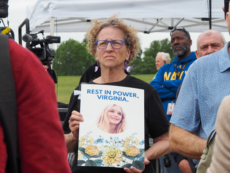 Pam Dandridge, 67, of Alexandria, Virginia, holds a sign at a memorial service for Virginia Roberts Giuffre in Washington, D.C., on Saturday, April 25, 2026. (Photo by Ashley Murray/States Newsroom)