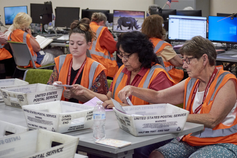 Election workers sort ballots at the Weld County Elections office in Greeley, Colorado, in June 2024. (Andrew Fraieli/Colorado Newsline)