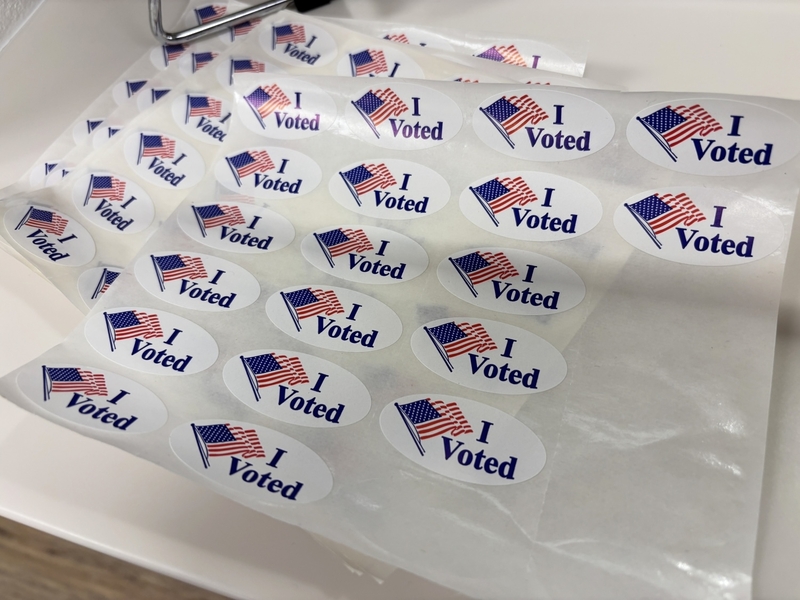 “I voted” stickers rest on a counter at the Pennington County Administration Building during early voting on Jan. 19, 2026, for a municipal election in Rapid City, South Dakota. (Photo by Seth Tupper/South Dakota Searchlight)