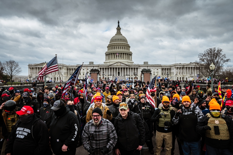 A mob of Trump supporters gathers in front of the U.S. Capitol Building on Jan. 6, 2021 in Washington, DC. An "anti-weaponization" fund was created by the Department of Justice in May 2026 that could make payments to those who took part in the Jan. 6 attack. (Photo by Jon Cherry/Getty Images