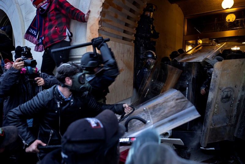 Donald Trump supporters clash with police and security forces in the attack on the US Capitol on Jan. 6, 2021 in Washington, D.C. (Photo by Brent Stirton/Getty Images)