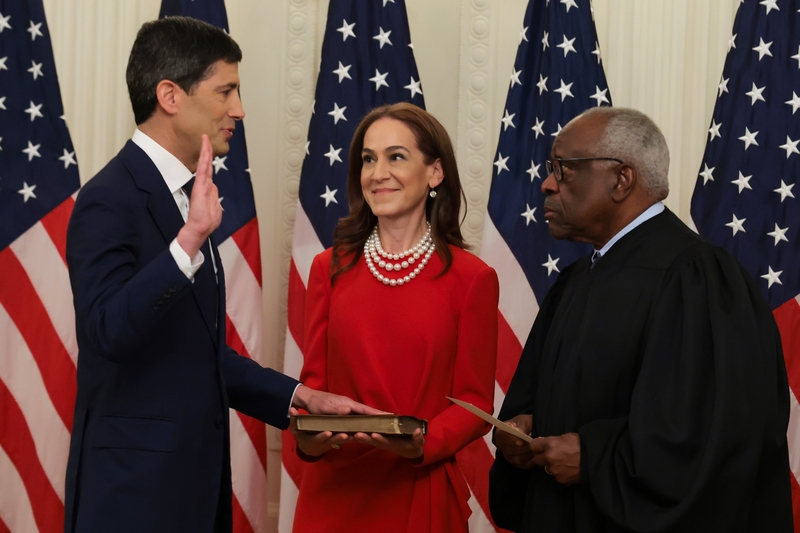 Kevin Warsh, left, takes the oath of office from U.S. Supreme Court Associate Justice Clarence Thomas, right, as Warsh's wife Jane Lauder looks on during his swearing-in ceremony to be the new chairman of the Federal Reserve in the East Room of the White House on May 22, 2026 in Washington, D.C. (Photo by Anna Moneymaker/Getty Images)