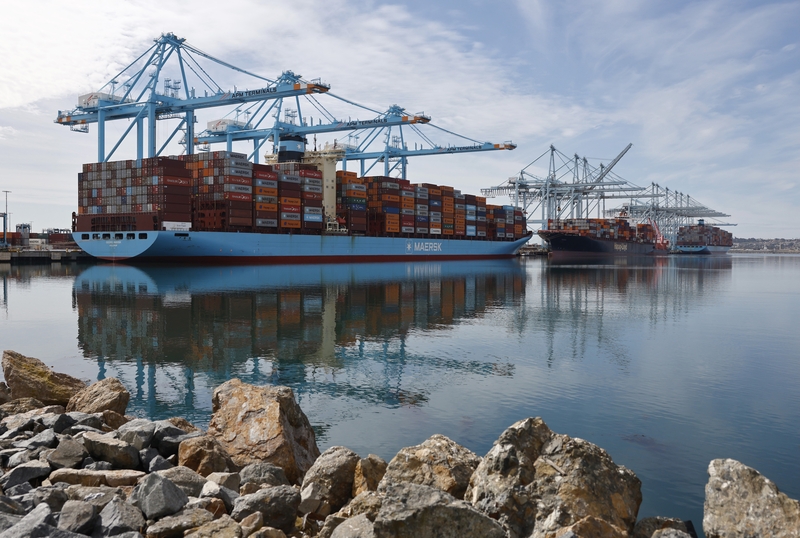 Shipping cranes stand above container ships loaded with shipping containers at the Port of Los Angeles on Feb. 20, 2026 in Los Angeles, California. the U.S. Court of International Trade on May 7, 2026, handed a win to small businesses that challenged the president's blanket Section 122 tariffs. (Photo by Mario Tama/Getty Images)