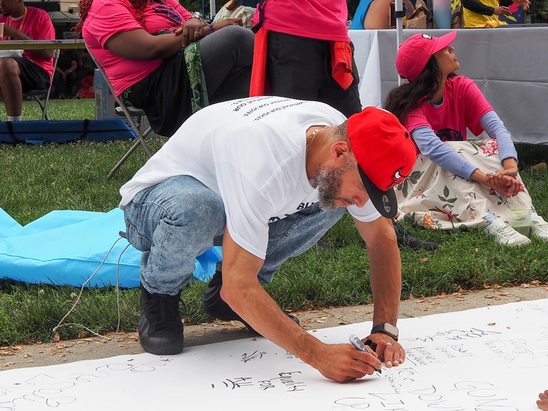 Pablo Andraes-Ranos, 44, of Hartford, Connecticut, who attended the Next250 march with Formerly Incarcerated, Convicted People &amp; Families Movement, signed the rally's "Declaration of Interdependence" in Washington, D.C., on Saturday, June 27, 2026. (Photo by Ashley Murray/States Newsroom)