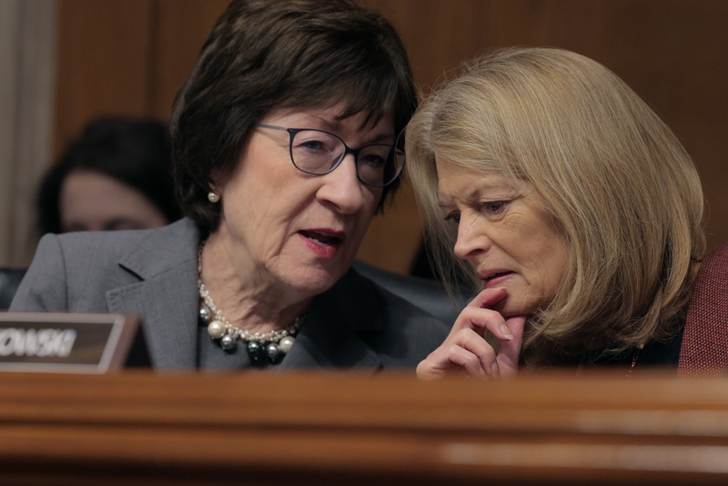 Senate Health, Education, Labor and Pensions Committee members Sen. Susan Collins (R-ME) (L) and Sen. Lisa Murkowski (R-AK) talk during the confirmation hearing for Lori Chavez-DeRemer, President Donald Trump’s pick to lead the Labor Department, in the Dirksen Senate Office Building on Capitol Hill on February 19, 2025 in Washington, DC. A former Republican member of Congress from Oregon, Chavez-DeRemer was questioned about her co-sponsorship for the pro-union Protecting the Right to Organize Act, which may