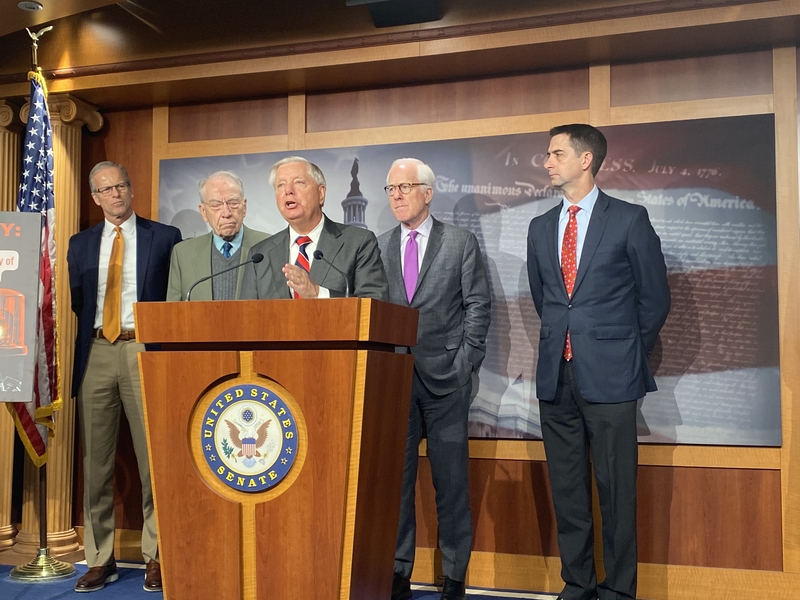 South Carolina Republican Sen. Lindsey Graham speaks during a press conference on Dec. 7, 2023 with other Republicans. From left to right are South Dakota Sen. John Thune, Iowa Sen. Chuck Grassley, Texas Sen. John Cornyn and Arkansas Sen. Tom Cotton.  (Photo by Jennifer Shutt/States Newsroom)
