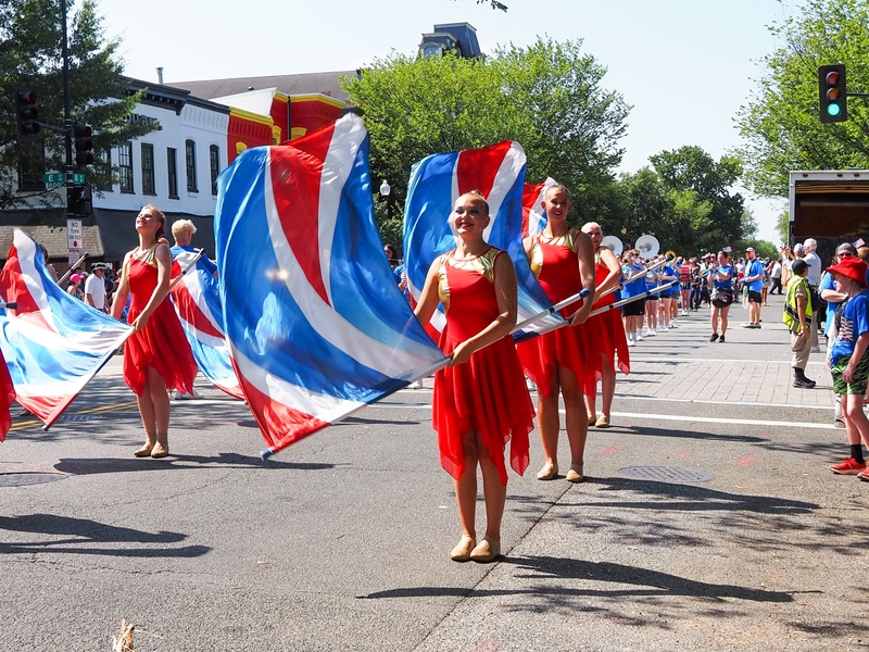 A color guard team marched with the Kerkhoven-Murdock-Sunberg High School band from Kerkhoven, Minnesota, in the Capitol Hill Fourth of July parade on Saturday, July 4, 2026 in Washington, D.C. (Photo by Ashley Murray/States Newsroom)