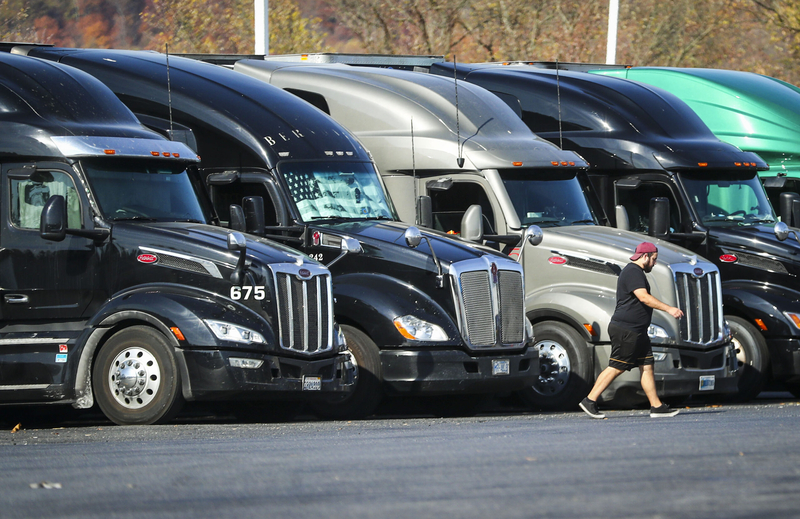 Tractor trailers sit parked in a row at a truck stop in Bloomsbury, N.J. (Dana DiFilippo | New Jersey Monitor)