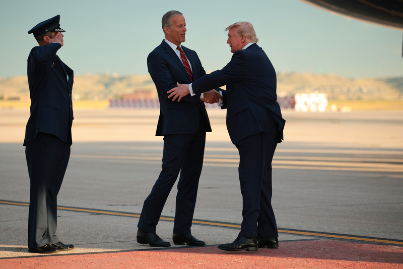 U.S. President Donald Trump is greeted by Senate Majority Leader John Thune (R-SD) on the tarmac after landing in Air Force One on July 03, 2026 at Ellsworth Air Force Base, South Dakota. Trump is holding a rally and fireworks show at Mount Rushmore, kicking off a weekend of 250th Independence Day celebrations across the country. (Photo by Chip Somodevilla/Getty Images)