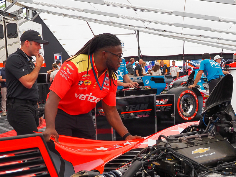 IndyCar rear-end mechanic Justin Moore, 24, of Statesboro, Georgia, assembled a carbon fiber sidepod on Team Penske race car ahead of the Freedom 250 Grand Prix in Washington, D.C., on Sunday, Aug. 23, 2026. (Photo by Ashley Murray/States Newsroom)