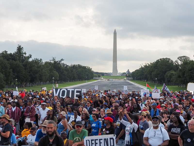 Demonstrators gathered at the Lincoln Memorial Reflecting Pool for an event in Washington, D.C., on Friday, Aug. 28, 2026, marking the 63rd anniversary of the March on Washington for Jobs and Freedom where the late civil rights leader Rev. Martin Luther King Jr. delivered his "I Have a Dream" speech. (Photo by Ashley Murray/States Newsroom)
