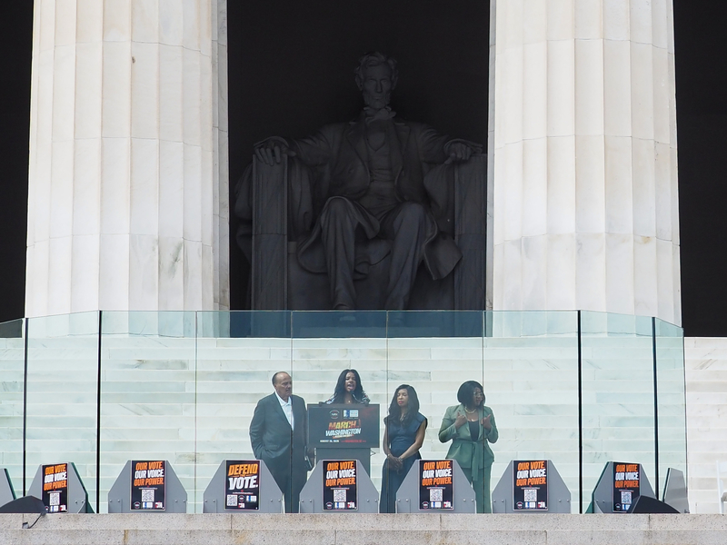 Family of the late civil rights icon Martin Luther King Jr., from left to right, son Martin Luther King III, granddaughter Yolanda Renee King and daughter-in-law Arndrea Waters King,&nbsp; along with a sign language interpreter, at the Lincoln Memorial in Washington, D.C., on Friday, Aug. 28, 2026, commemorating the 63rd anniversary of the March on Washington for Jobs and Freedom. (Photo by Ashley Murray/States Newsroom)