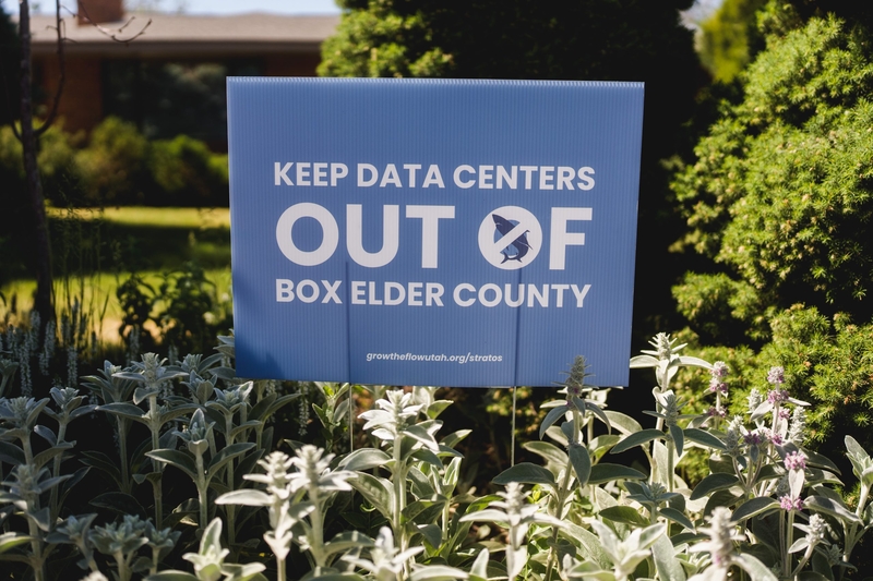 A sign is posted ouside the home of Brenna Williams, an organizer with Box Elder Accountability Referendum, which is opposing the Stratos Project data center, in Brigham City, Utah, on Thursday, May 28, 2026. (Photo by Spenser Heaps/Utah News Dispatch)
