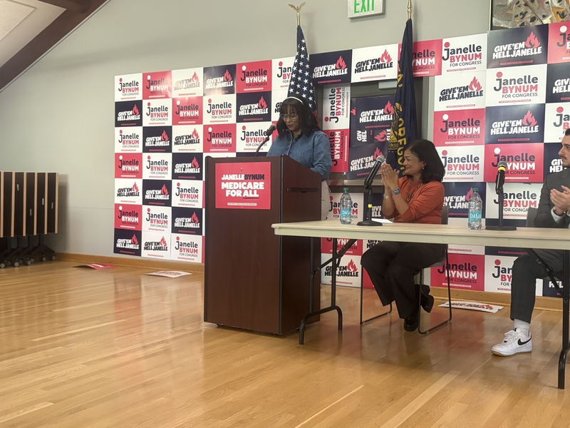 U.S. Rep. Janelle Bynum, D-Ore., addresses voters at Portland Community College in Portland, Oregon, on Oct. 13, 2026. U.S. Rep Pramila Jayapal, D-Wash., is seated. (Photo by Jacob Fischler/States Newsroom)