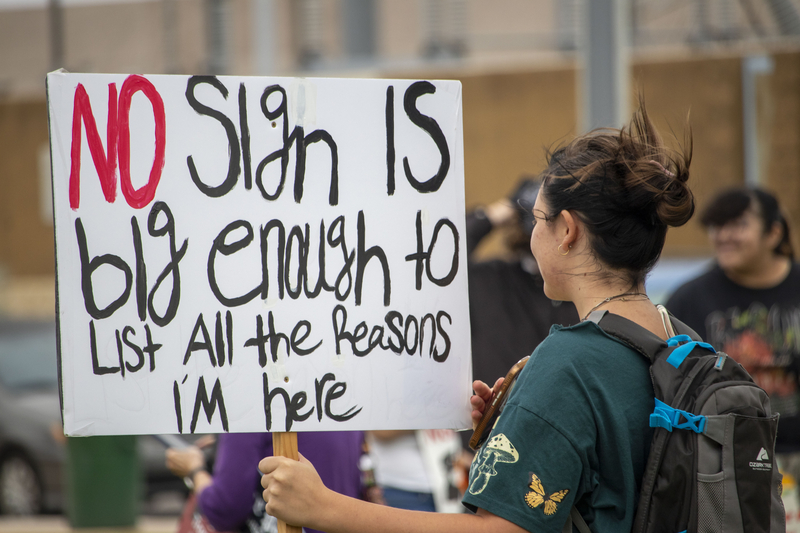 Rose Kelly, 17, holding her homemade sign