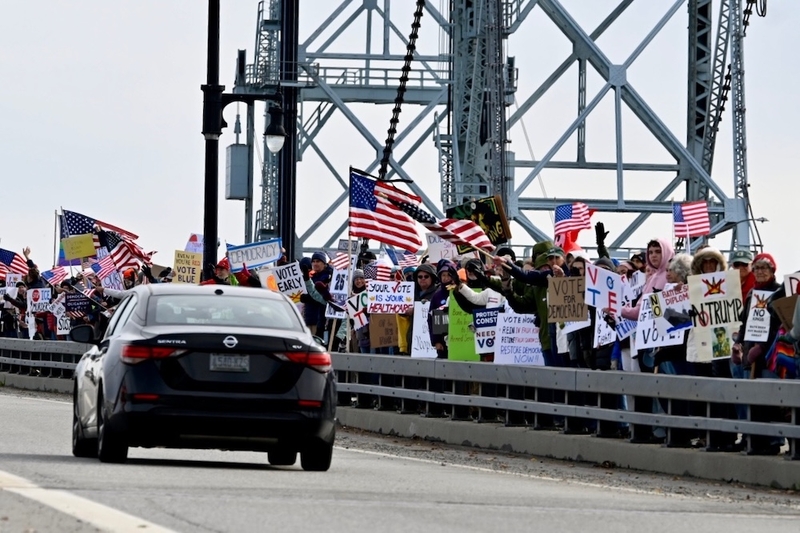 A crowd of roughly 400 gathered on the Sagadahoc Bridge in Bath, Maine. Jessica Mahnke, a spokesperson for organizers, said of this No Kings mobilization: "It’s a different event. It’s not a protest — it has a different temperament than the usual protests.” (Photo by Jim Neuger/ Maine Morning Star)