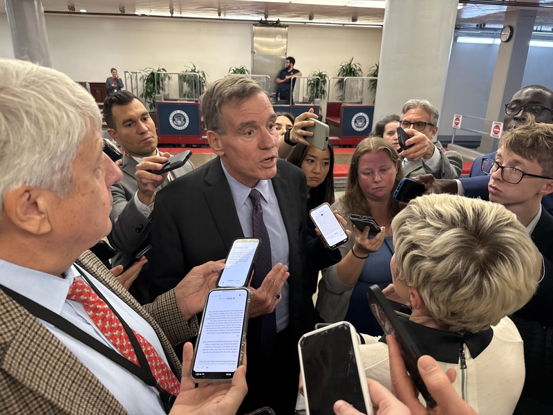 Virginia Sen. Mark Warner speaks with reporters in the U.S. Capitol building on Wednesday, Oct. 1, 2025. (Photo by Jennifer Shutt/States Newsroom)