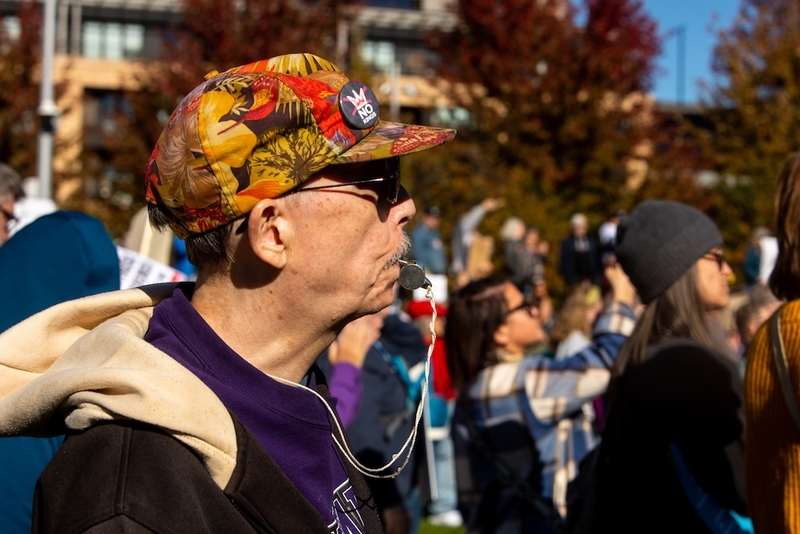 Gary North blows a whistle — an enduring symbol of the resistance against President Donald Trump's immigration crackdown in Minnesota — as hundreds gather in downtown Minneapolis for the national No Kings rally to encourage midterm voting Saturday.