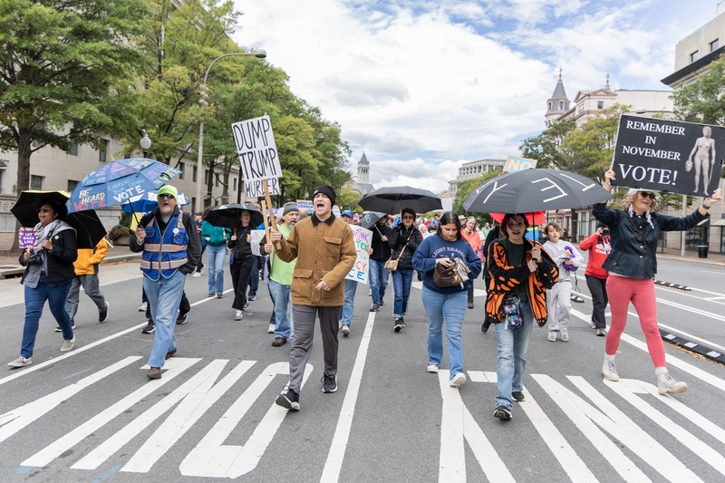 Participants in a No Kings day event march toward the U.S. Capitol in Washington, D.C., on Oct. 17, 2026. The Umbrella Walk 4 Change was one of thousands of No Kings events across the nation encouraging early voting. (Photo by Baya Burgess/States Newsroom)