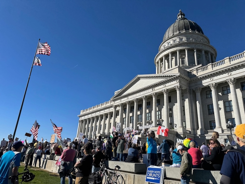 Around 2,000 people gathered at the Capitol in Salt Lake City for a rally and No Kings day of action to encourage early voting. The group marched downtown, and took ballots to drop boxes by the City Library and City Hall. (Photo by McKenzie Romero/Utah News Dispatch)