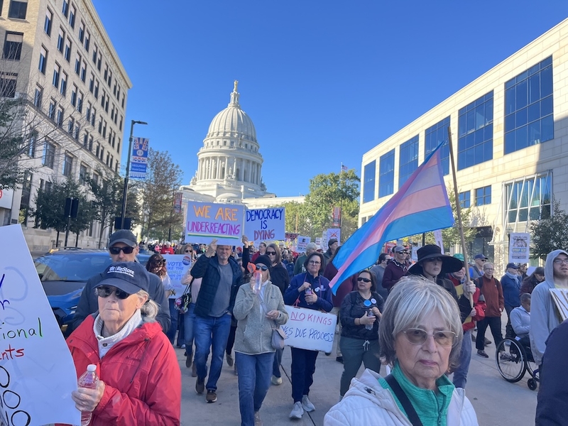 More than 1,000 people marched through downtown Madison, Wisconsin, Saturday, around the Capitol, carrying signs protesting the Trump administration and urging people to vote early in the midterms. (Photo by Ruth Conniff/Wisconsin Examiner)