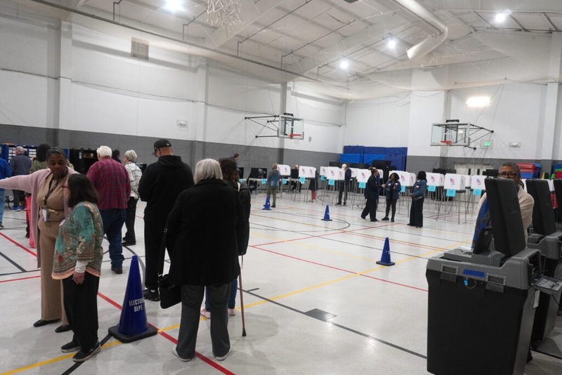 On a quiet first day of early voting, officials make a lot of noise about Question 3