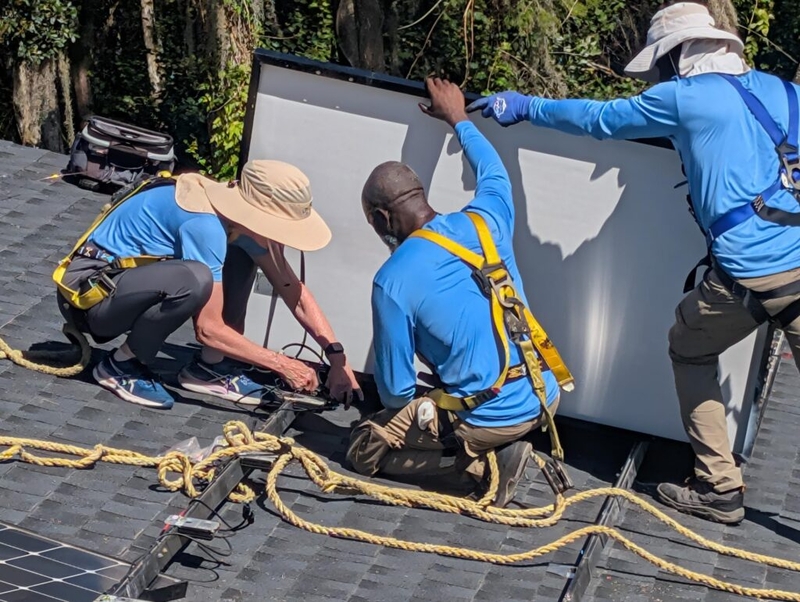 Gwen Graham spends a ‘workday’ helping to install solar panels