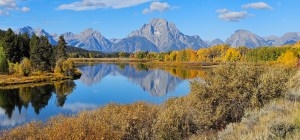 Mount Moran's reflection ripples across the waters of Oxbow Bend on a crisp fall day in 2025. (Rebecca Huntington/WyoFile)