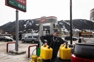 Neil Albert, of Victor, Idaho, lifts gallons of red-dyed diesel fuel into the bed of his truck Wednesday, March 11, 2026, at the Phillips 66 gas station in Jackson. Gas prices around the country have soared following the start of the war in Iran and costs around Jackson are no exception. (Charlie Nick/Jackson Hole Daily)