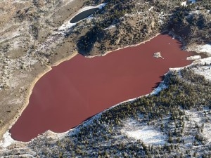 Little Soda Lake, pictured here in April 2026, has retained a rusty, red color into a third calendar year. (Wyoming Game and Fish Department)