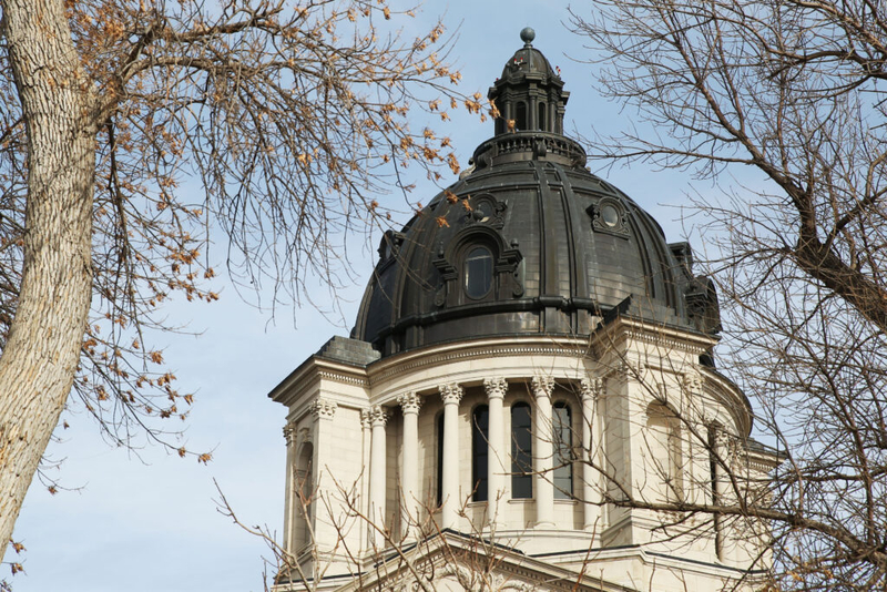 Governor celebrates surplus as Democratic lawmaker says state missed opportunities to help people