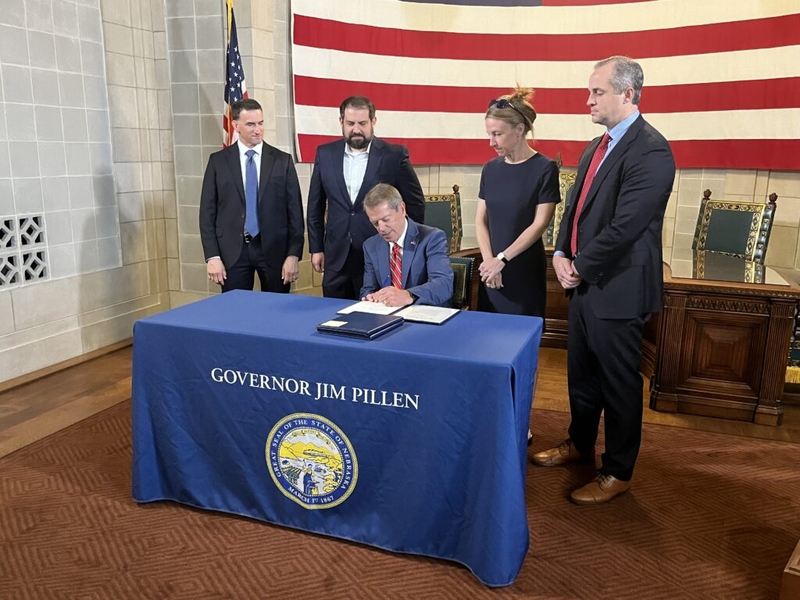 Pillen continues push for protections against China, other foreign adversaries, at bill signing