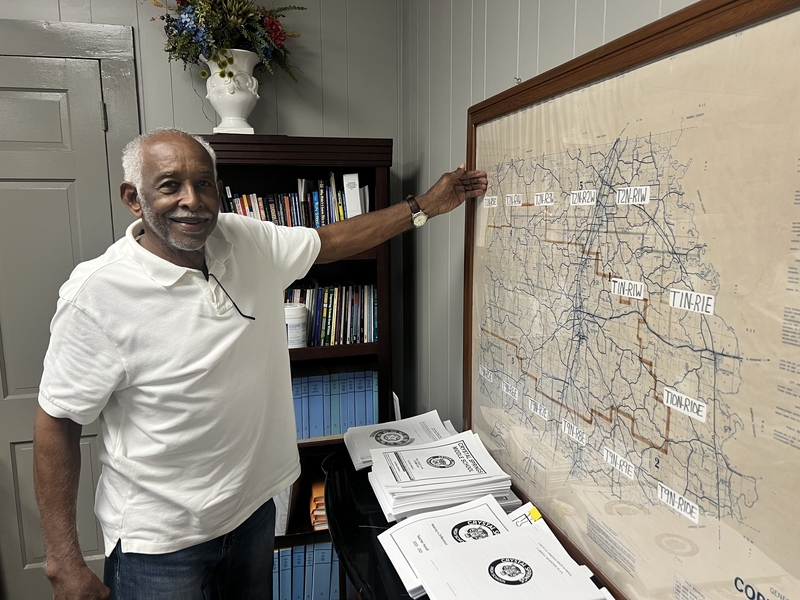 Jimmy Buchanan Sr., former assistant superintent of the Copiaah County School District, talks about the different school zones displayed on a map in the district office in Hazlehurst,, Miss., on Sept. 3, 2025. Credit: Leonardo Bevilacqua/Mississippi Today